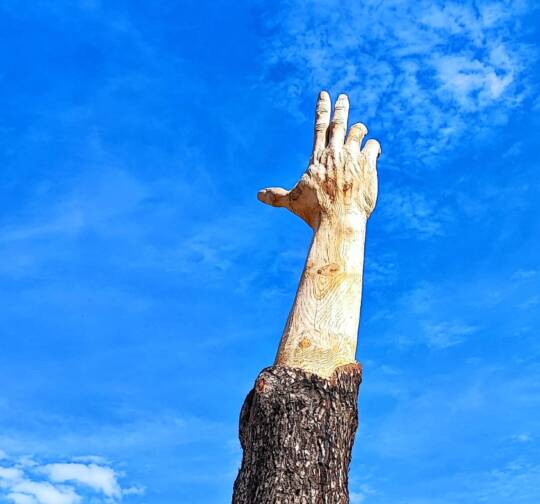 A hand between Sky